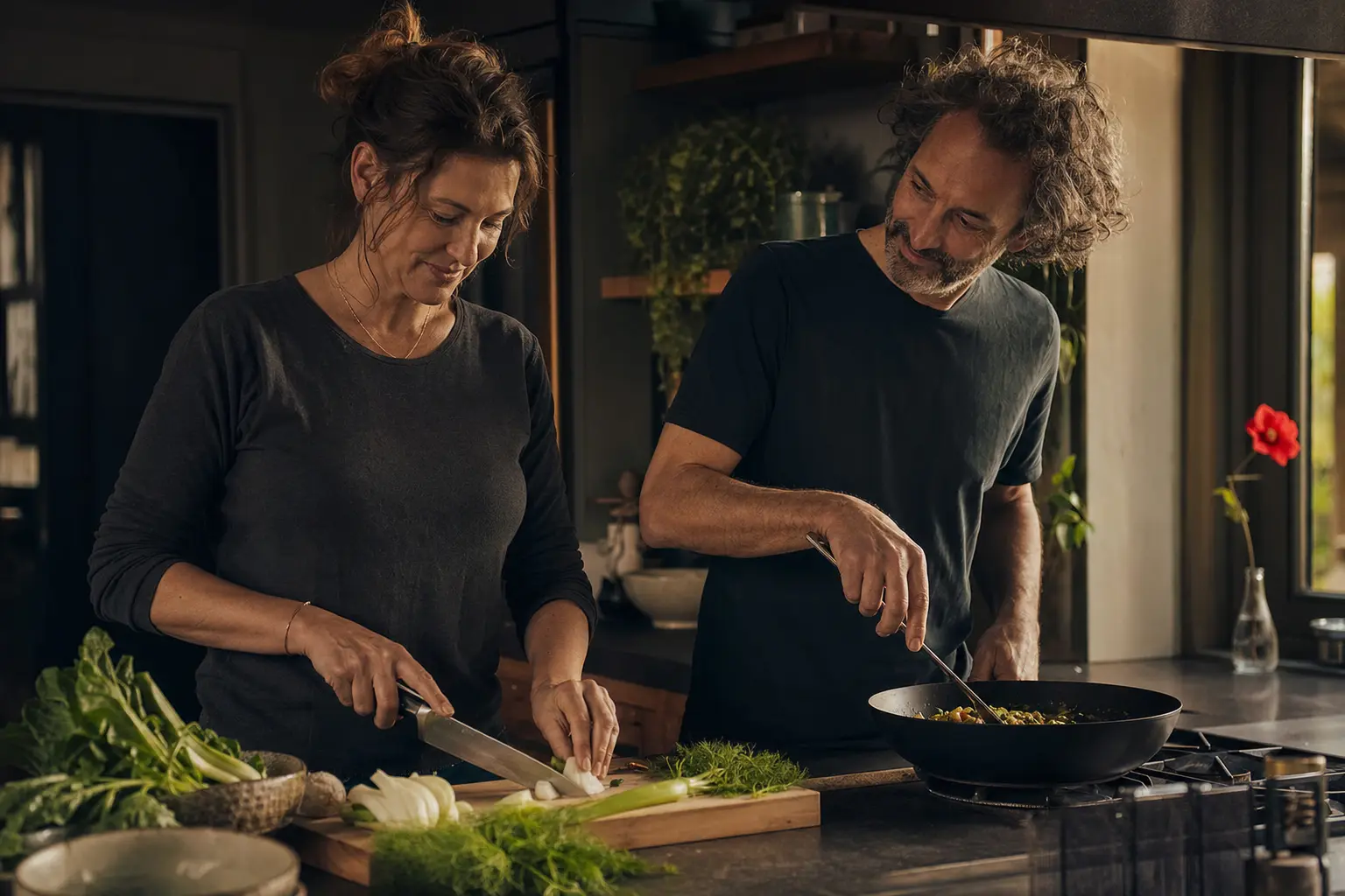 A couple cooking a simple dinner together.